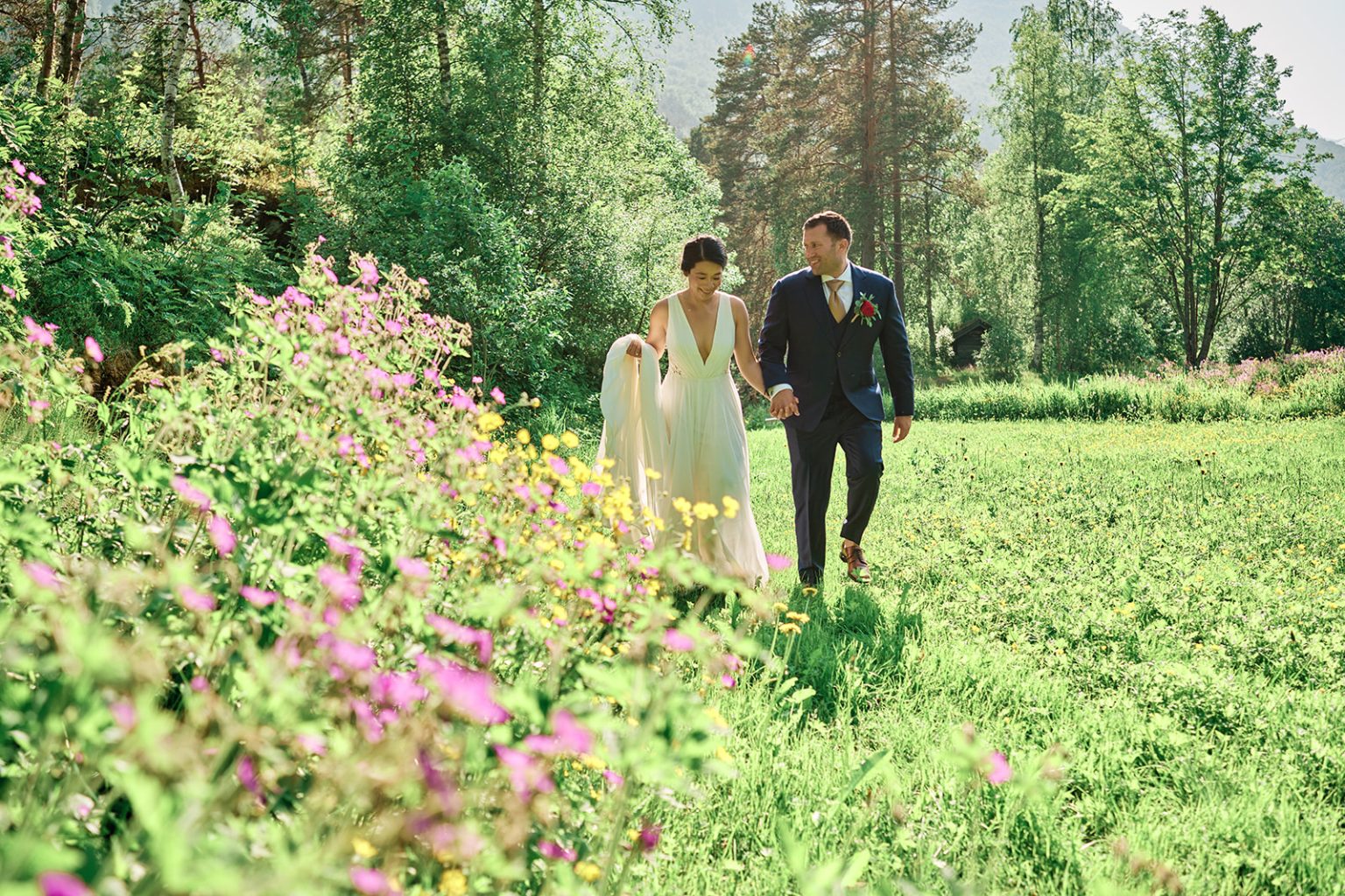 Nina and Will in a field of wildflowers