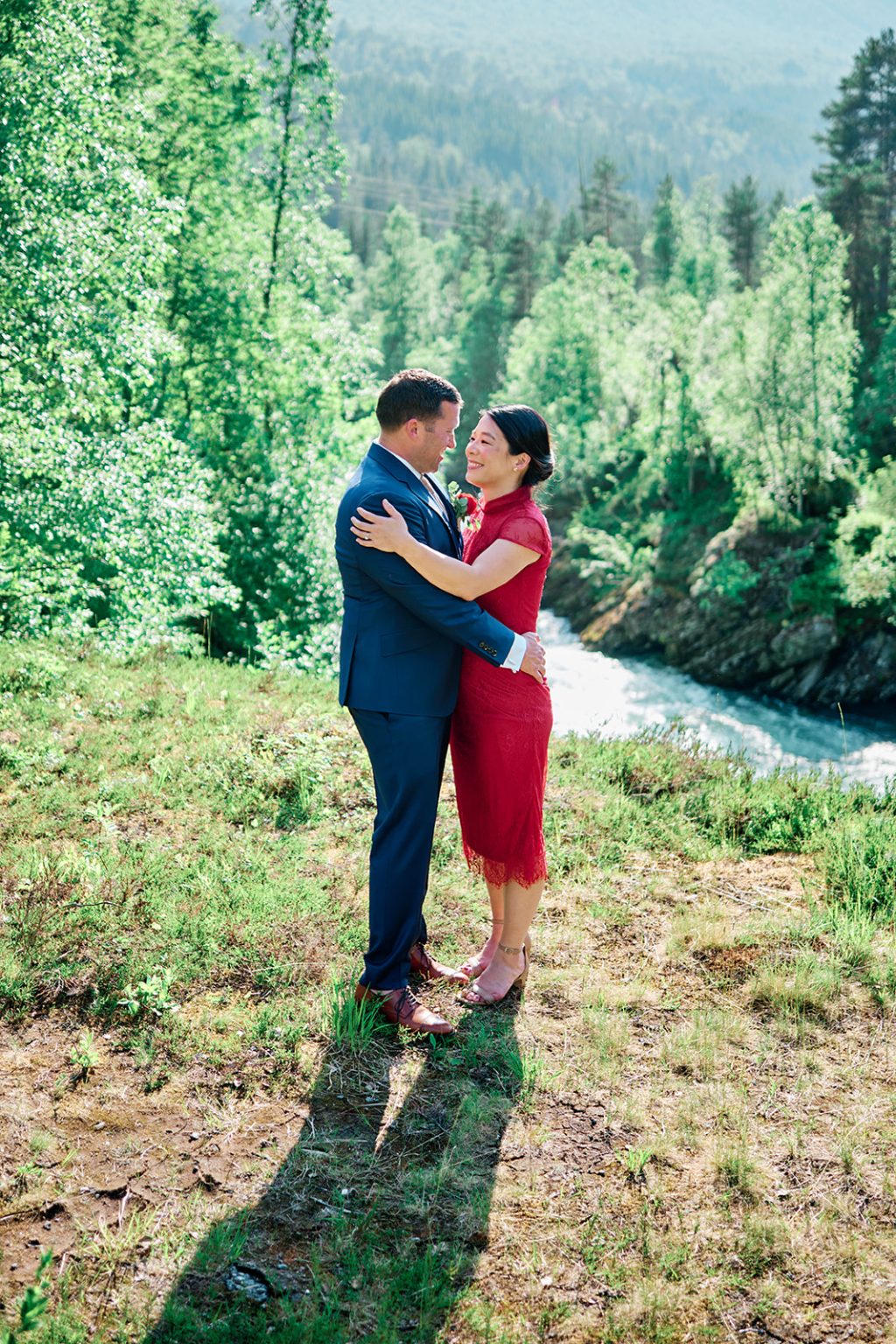 Nina in her red dress by the river