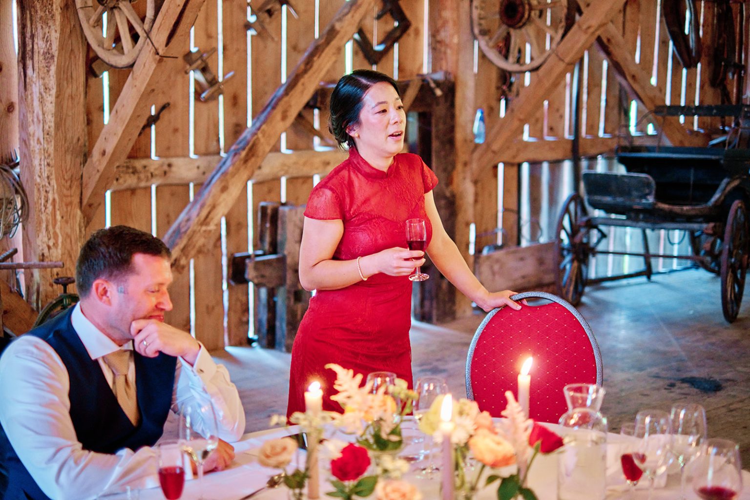 The bride in red during the barn reception
