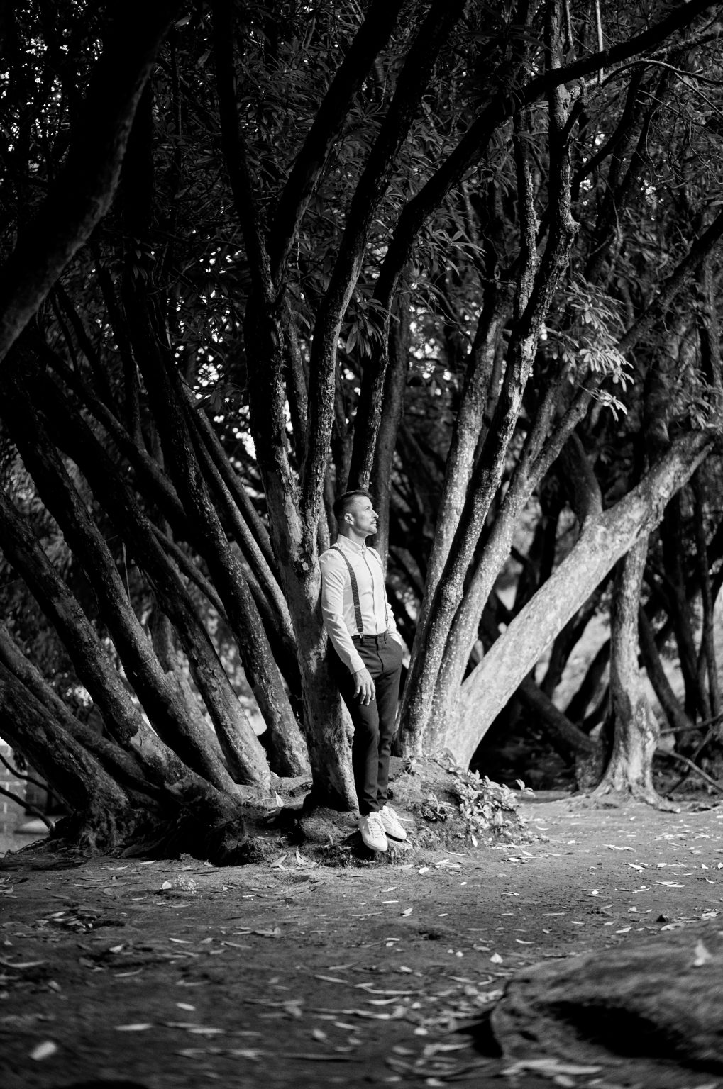 Bride beneath the old laurels of the Queimadas forest in black and white, Madeira