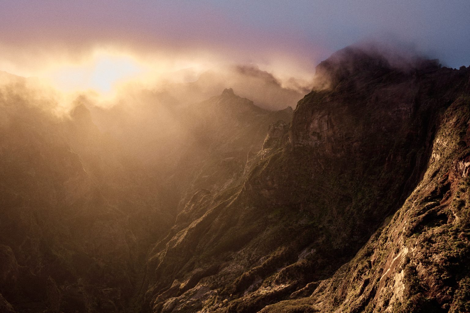 Light breaking over the mountains before sunset at Pico do Arieiro, Madeira
