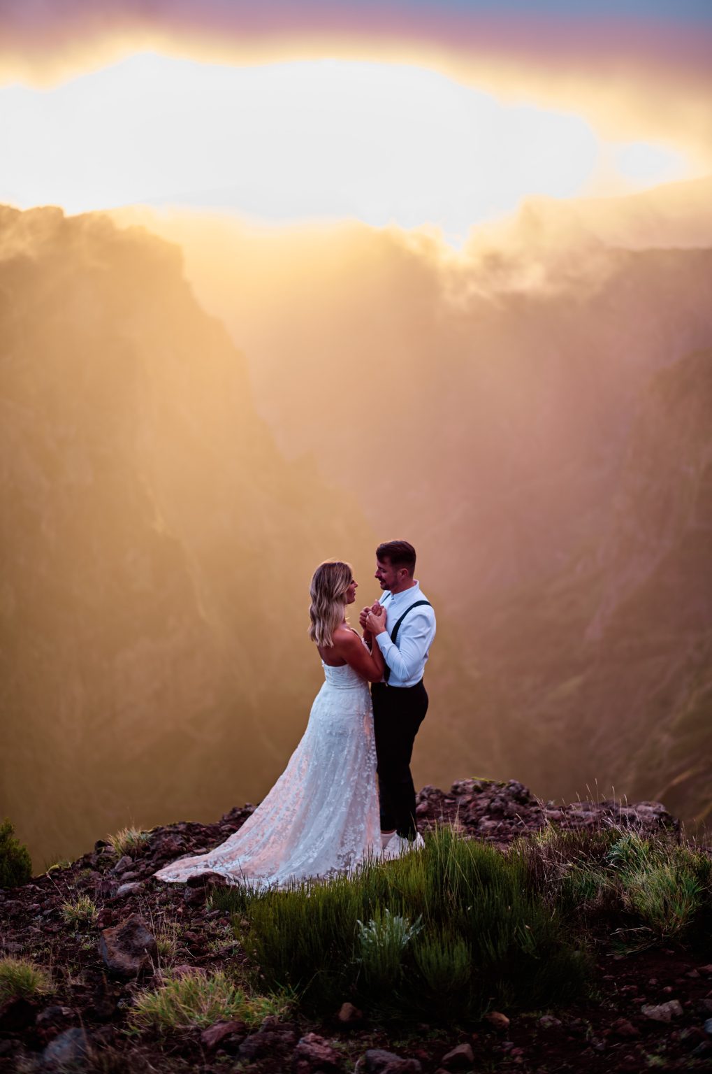 Couple embracing in orange sunset light, Pico do Arieiro, Madeira