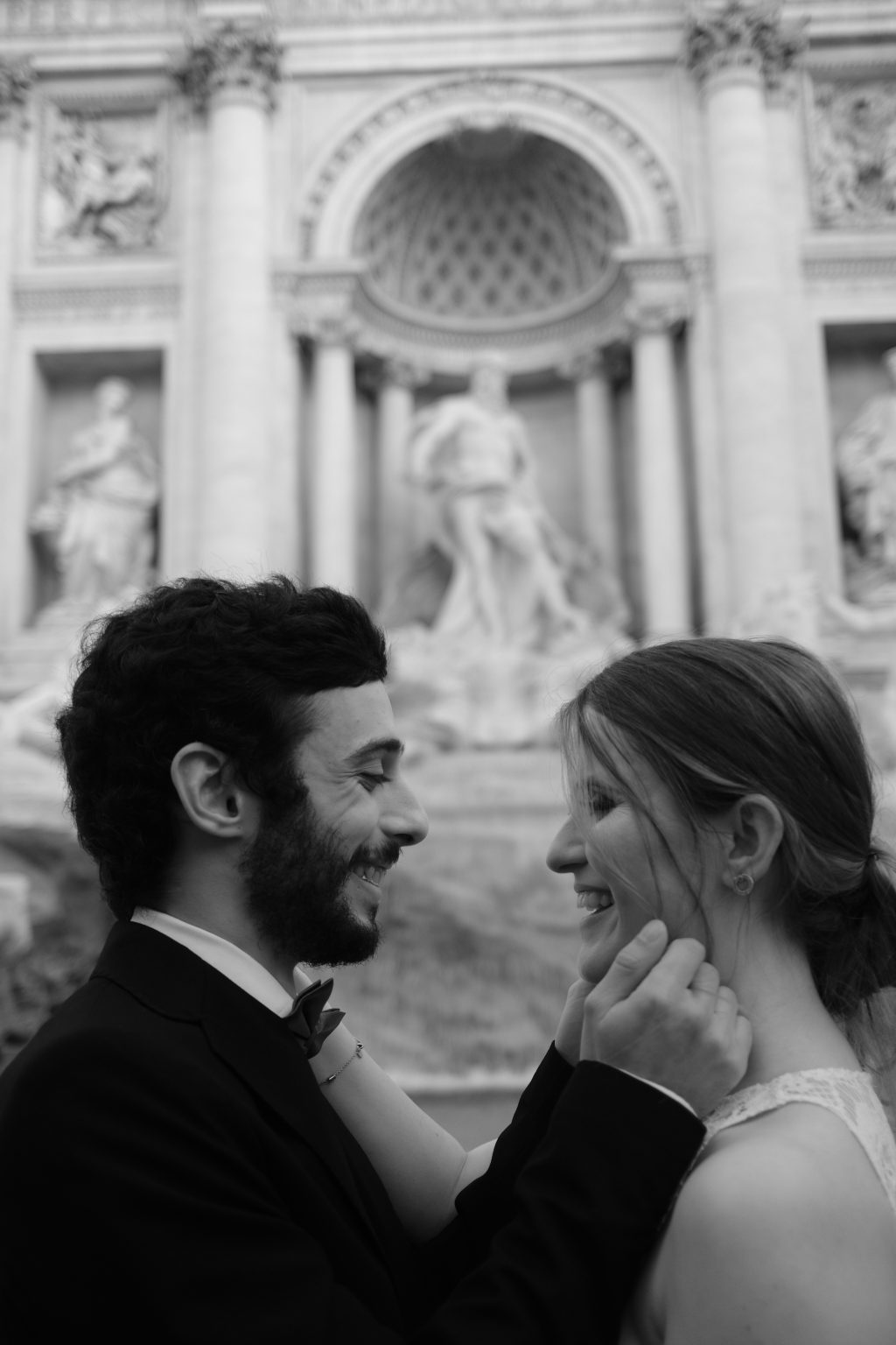 A close portrait of Salvatore and Rozina, his hand on her cheek, Rome engagement session