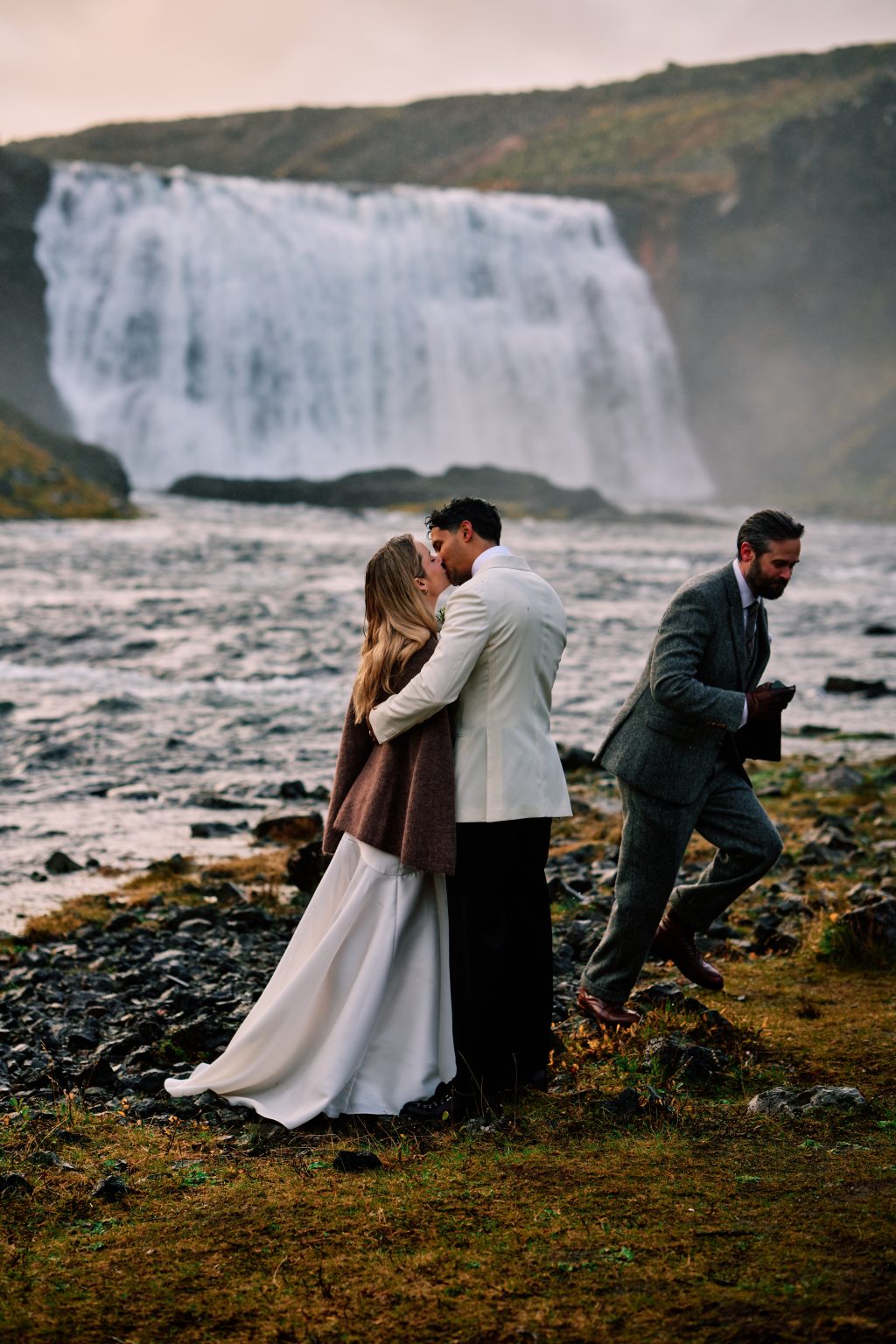 First kiss as a married couple beside the river at Þórufoss