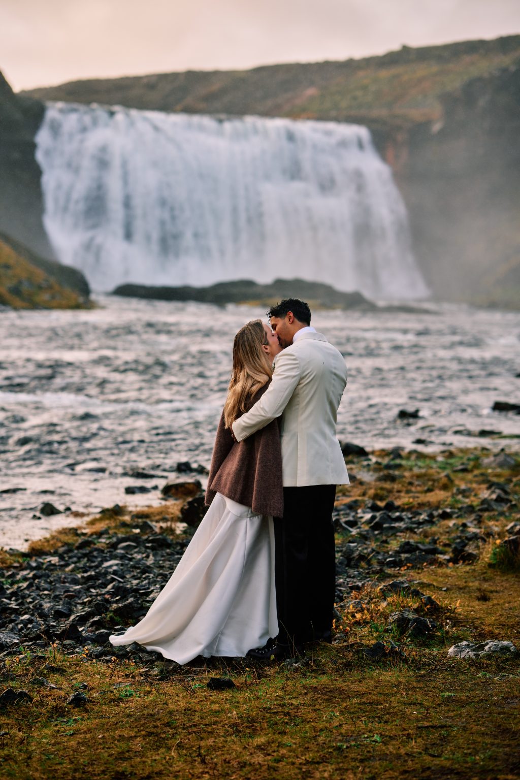 Lindsey and Daniel embracing after their waterfall ceremony