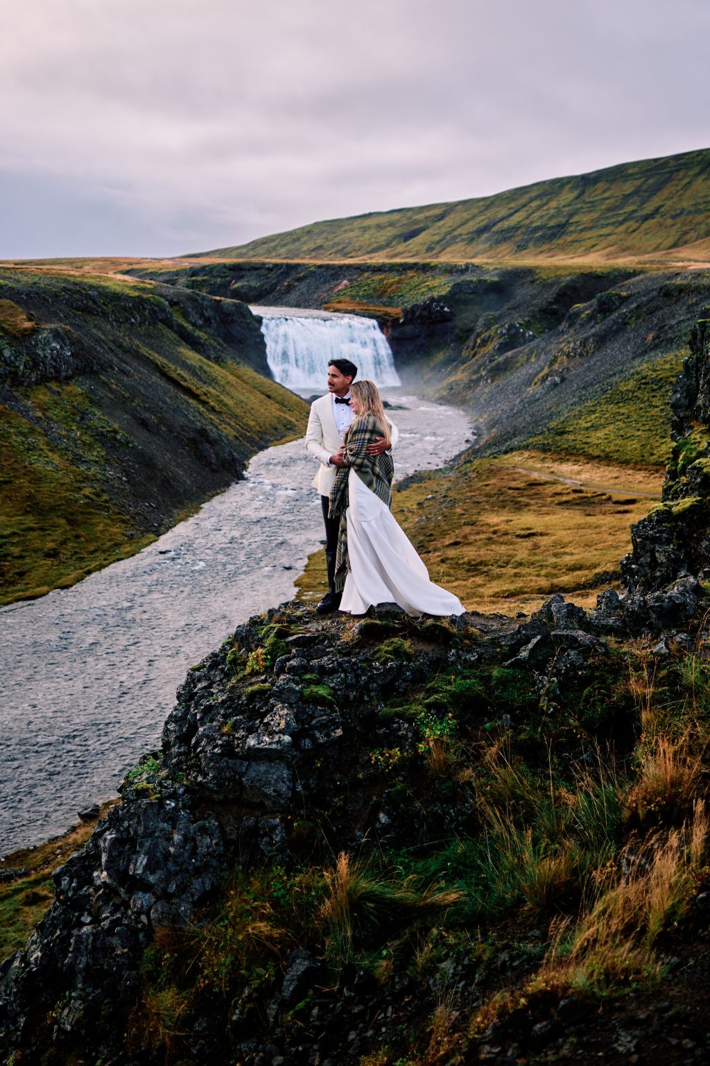 Lindsey and Daniel above a glacial river in Iceland
