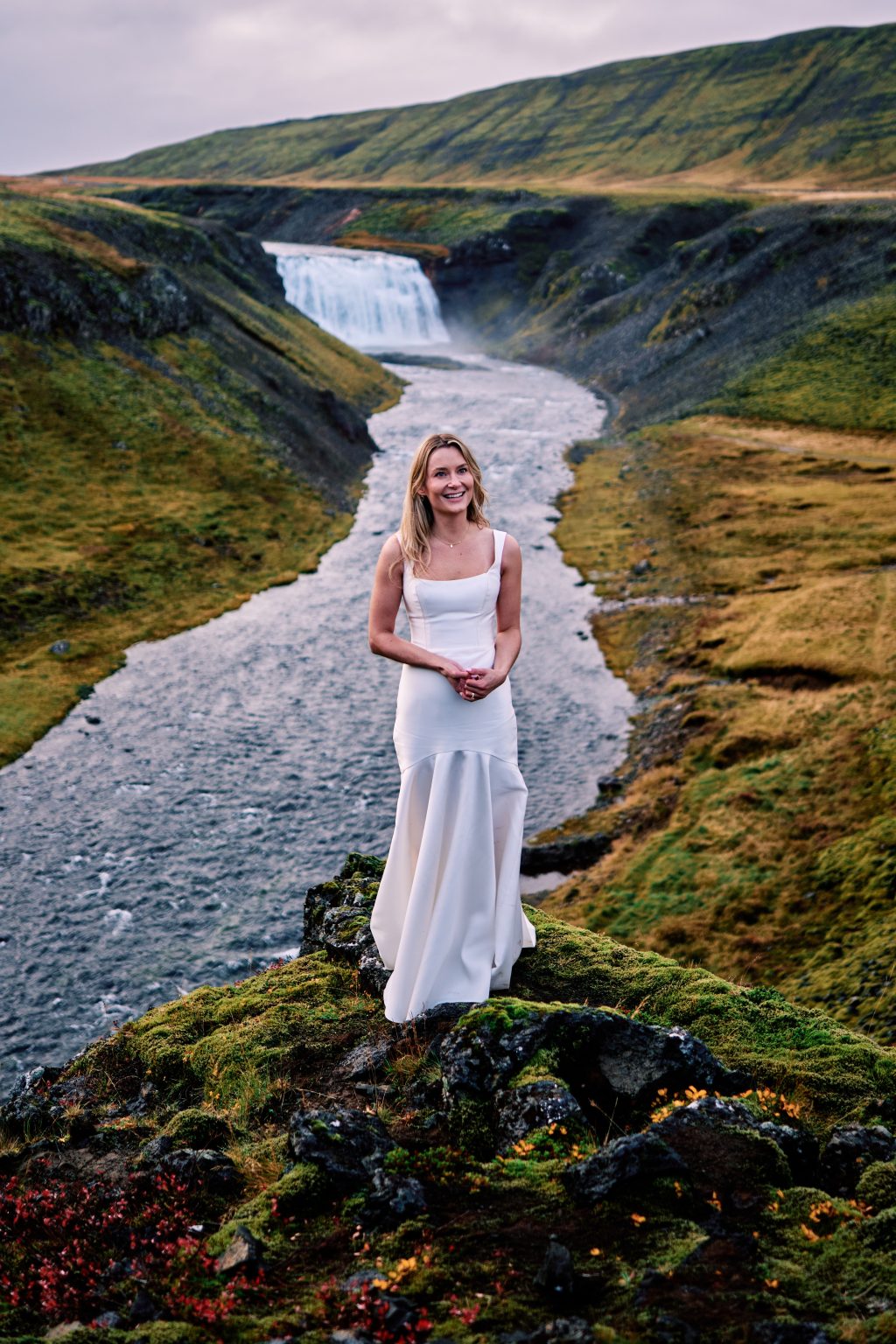 Lindsey in her wedding dress by the river near Þingvallavatn