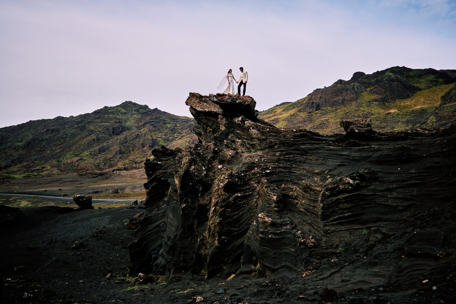 Lindsey and Daniel on the cliff formations at Indjánahöfði, Iceland