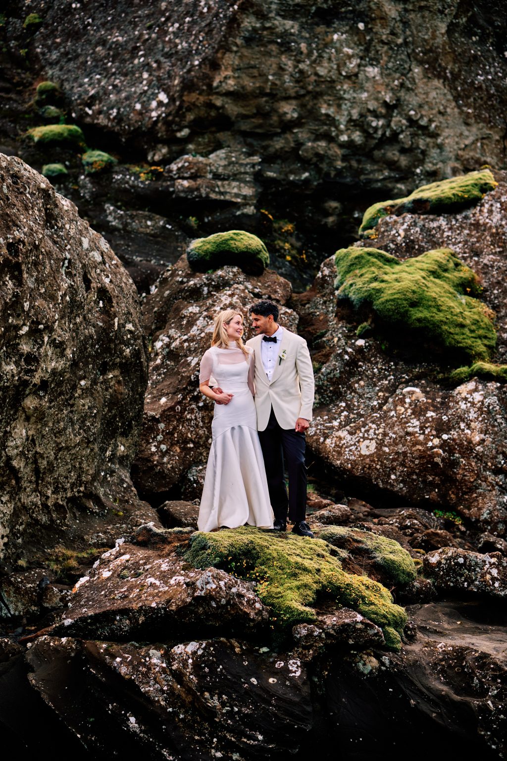 Newlyweds among the moss-covered lava near Krýsuvík