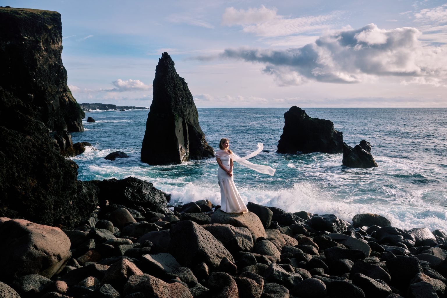 Bride at the Valahnúkamöl sea stacks on the Reykjanes peninsula
