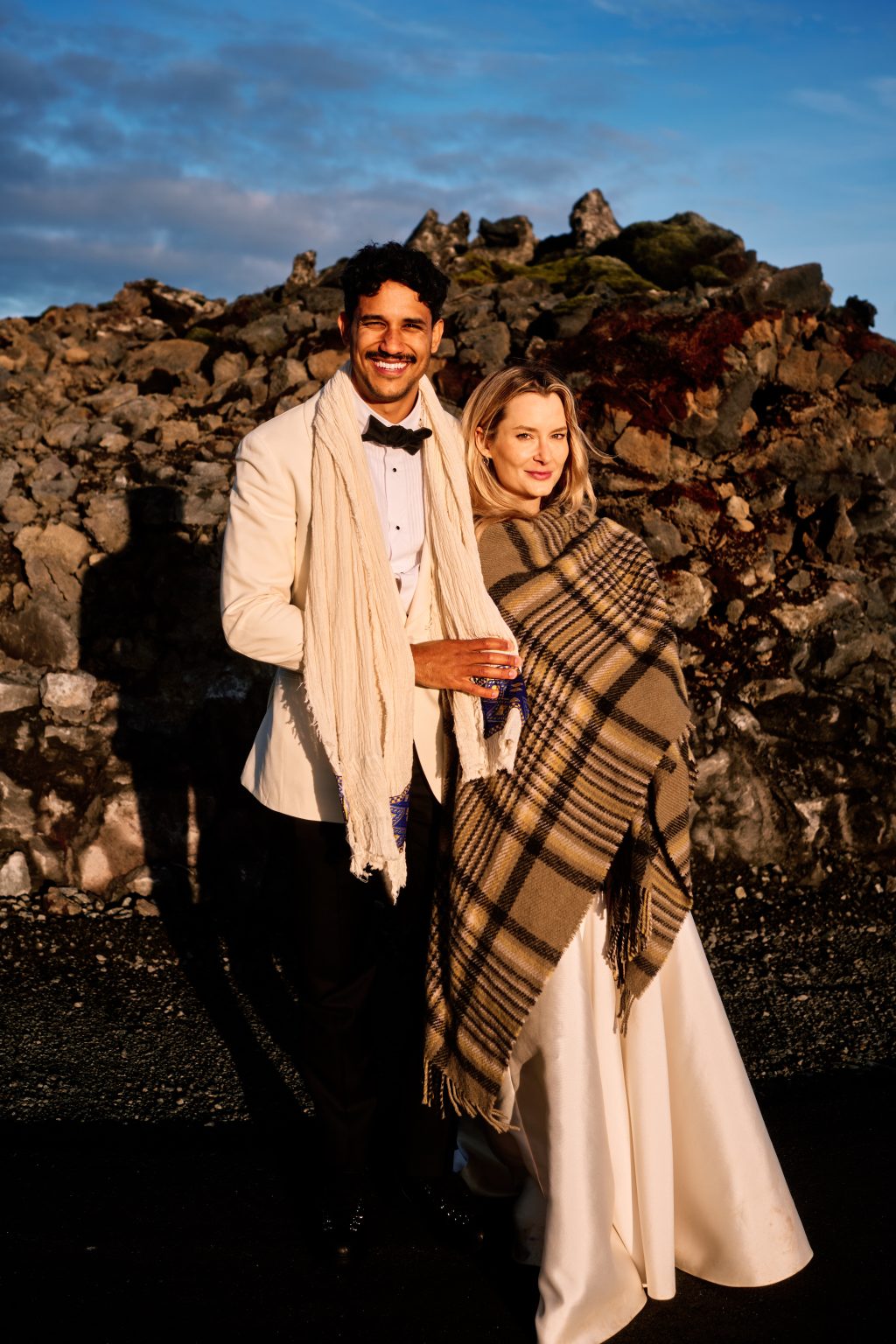 Wrapped in a wool blanket in the last light of an Iceland elopement