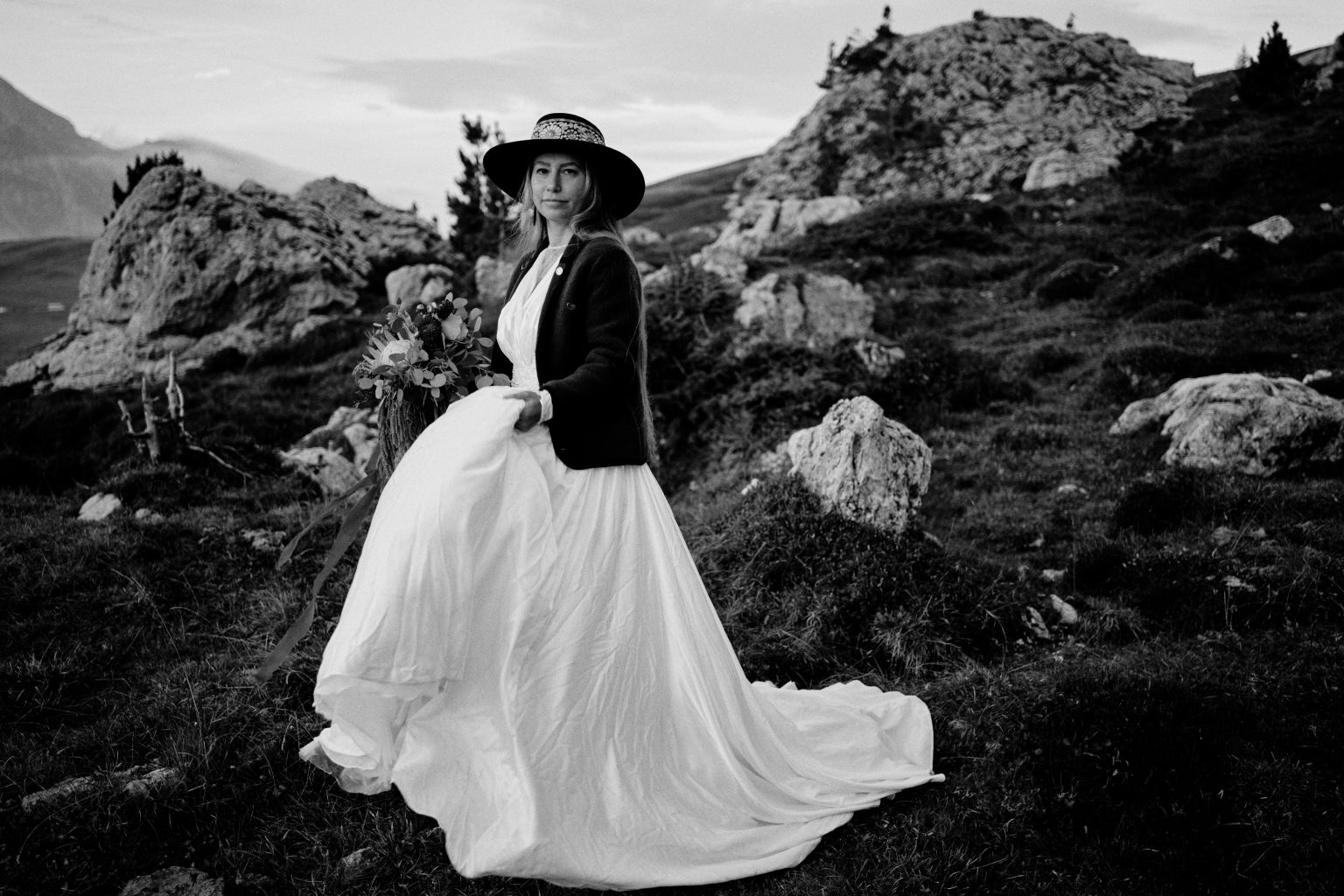 Passo Giau elopement, the couple small against the Ra Gusela