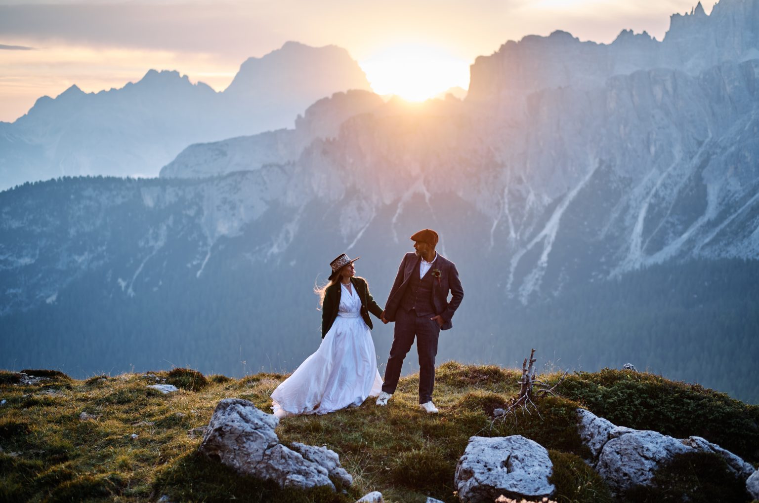 The couple together on the grass at Passo Giau at dawn