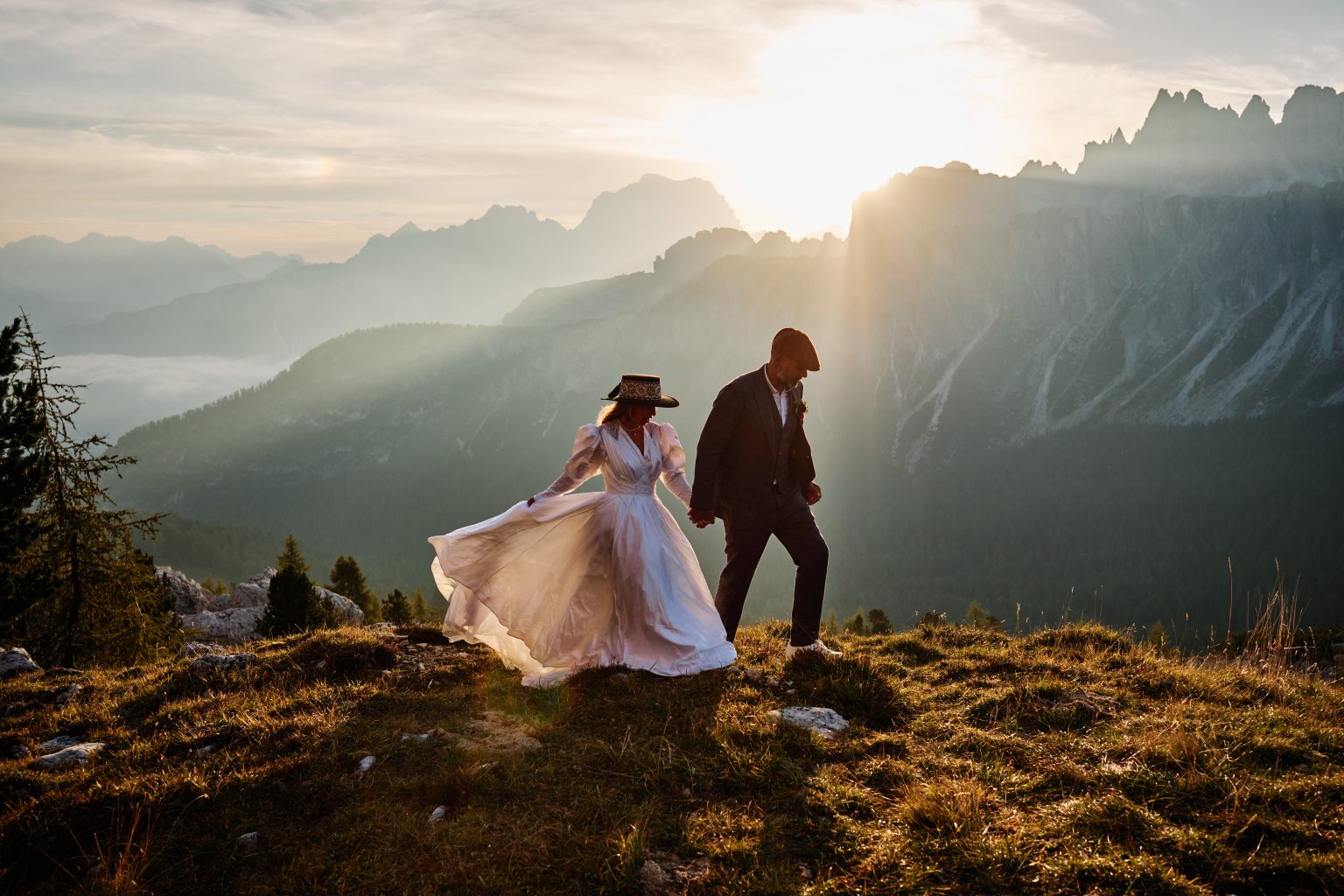 Lilly and Vic in golden light at Passo Giau