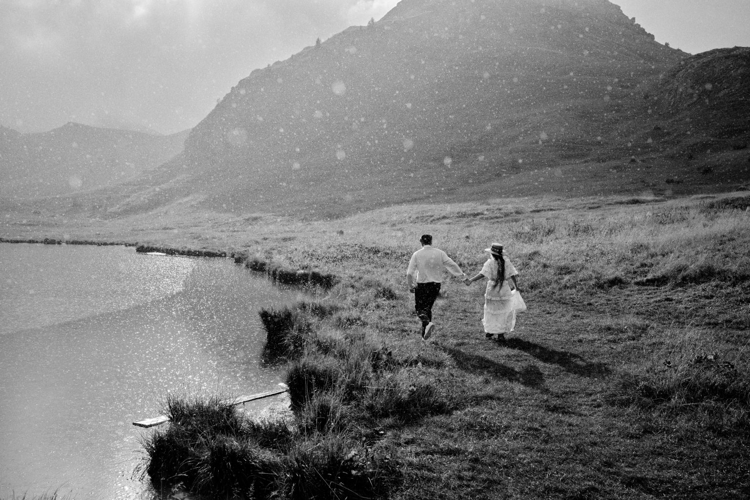 Lilly and Vic laughing through the shower at the Gardena Pass