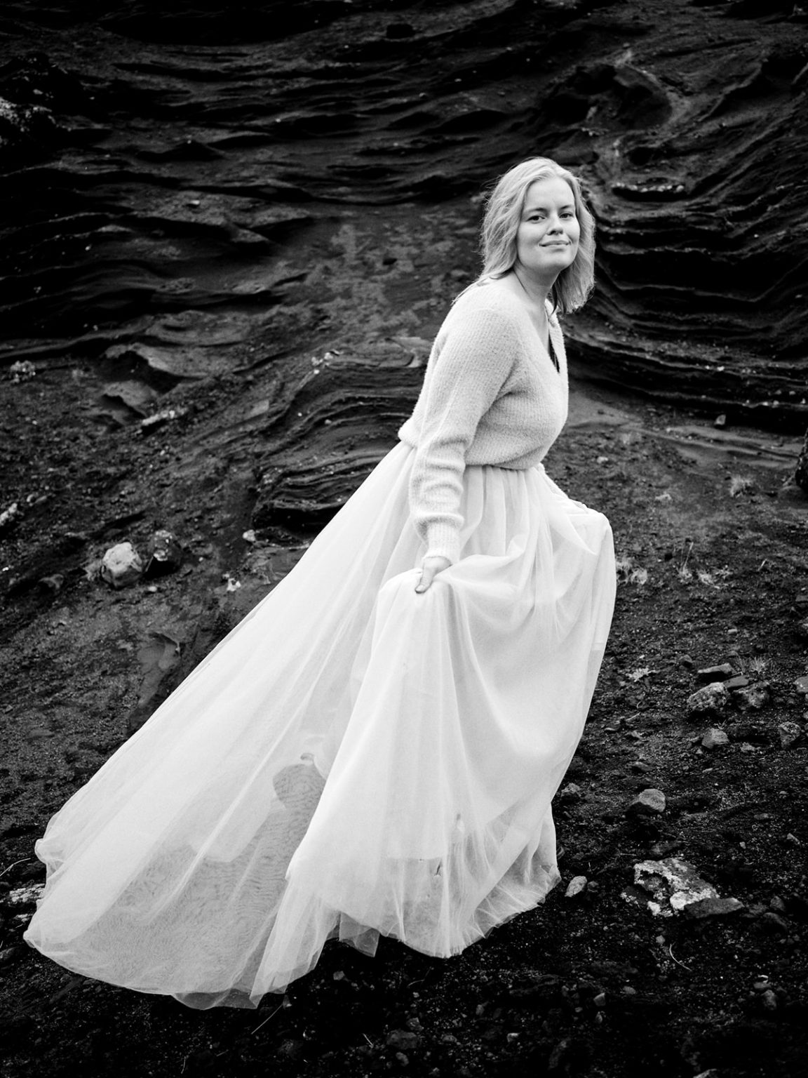 On the black lava in a flowing gown, a Reykjanes engagement