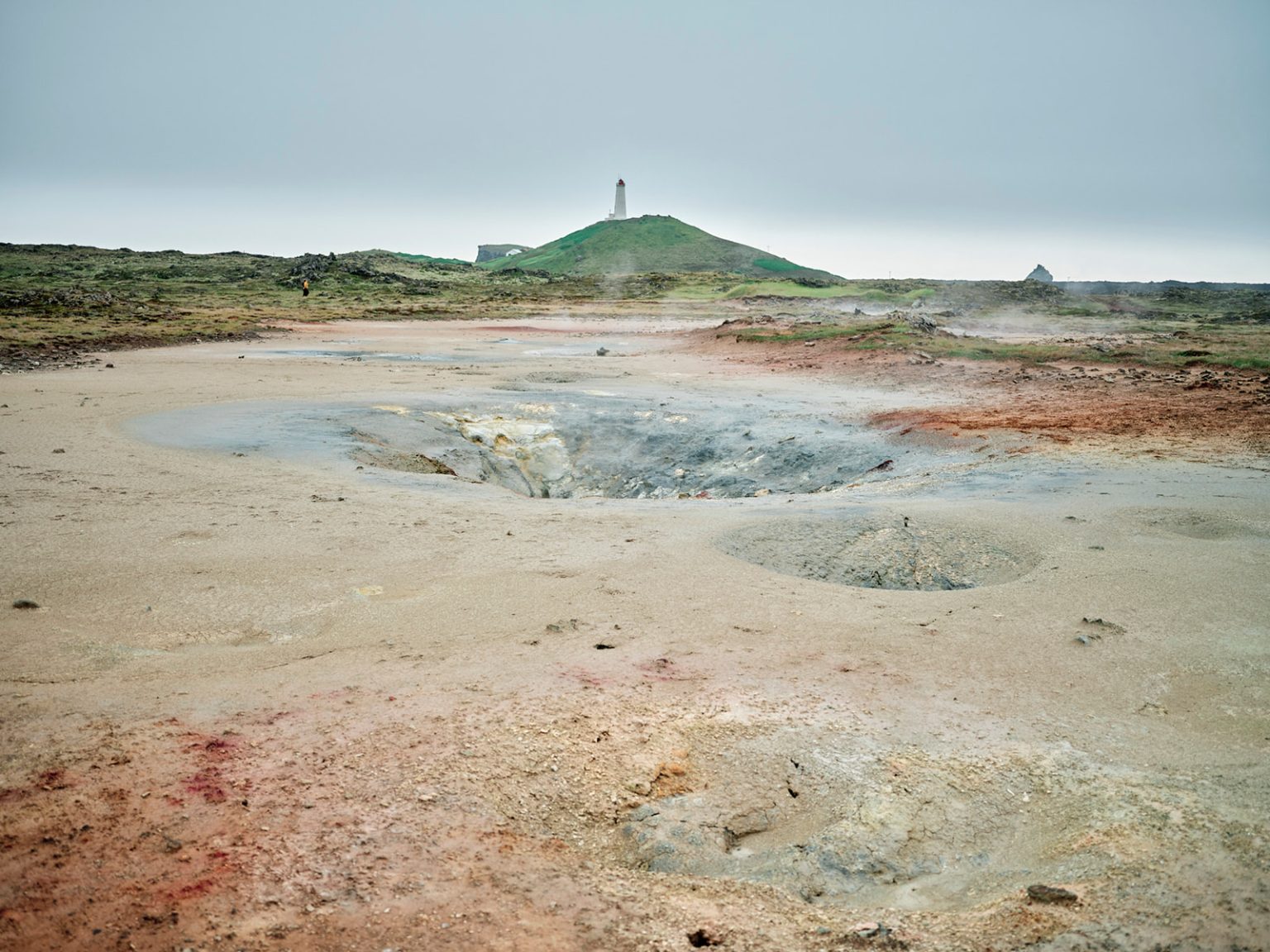 A geothermal field and lighthouse on Reykjanes, Iceland