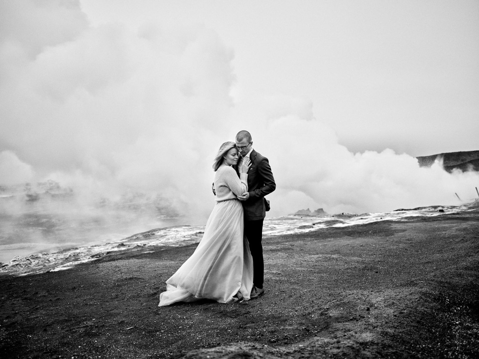 Kim and Daniel in the geothermal steam, black and white, Reykjanes