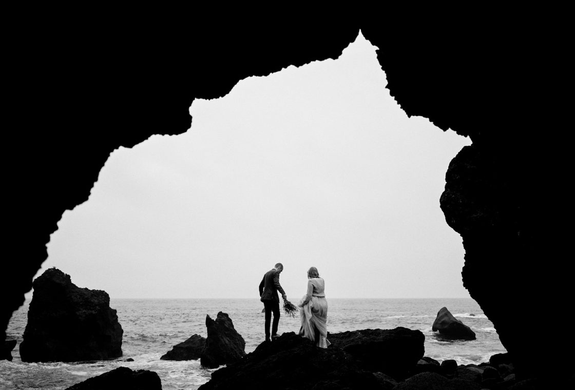 Kim and Daniel in a lava sea arch on Reykjanes, a Reykjanes engagement