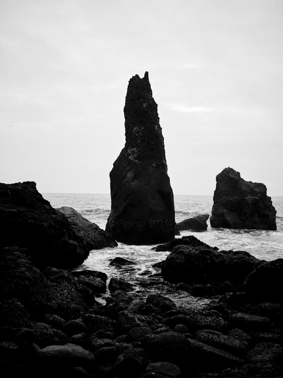 The Karl sea stack off Reykjanes in black and white, Iceland