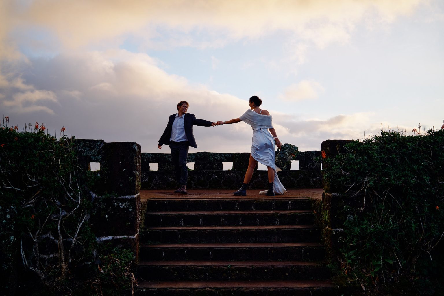 The couple on stone steps at a São Miguel viewpoint