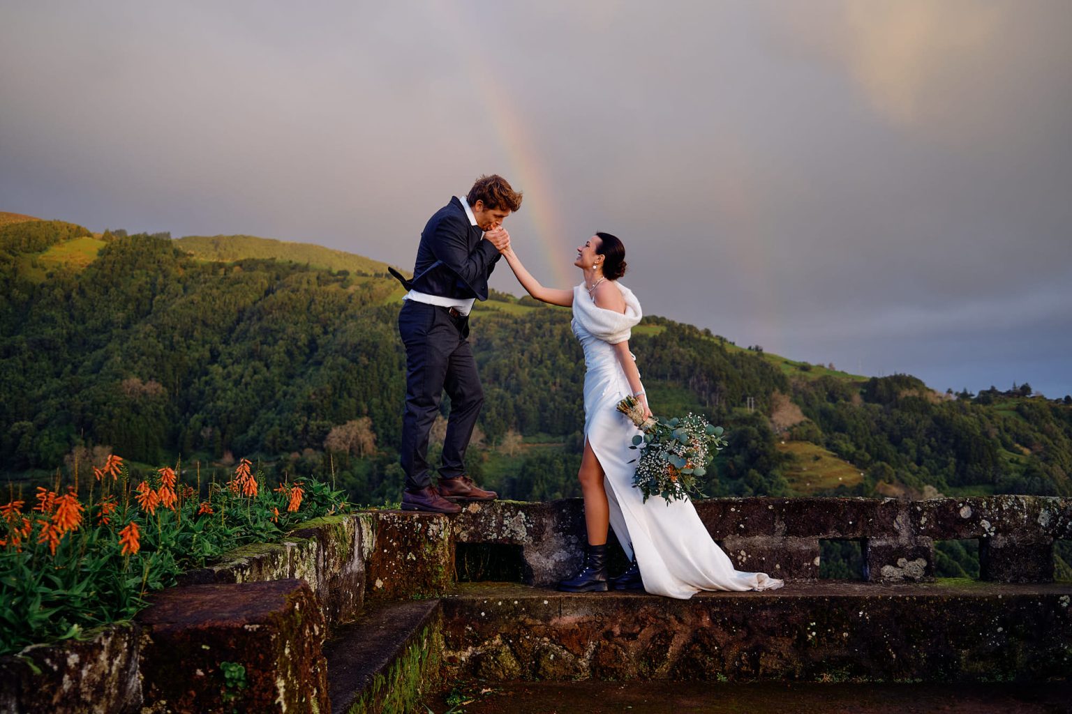 A rainbow over a São Miguel viewpoint with the couple