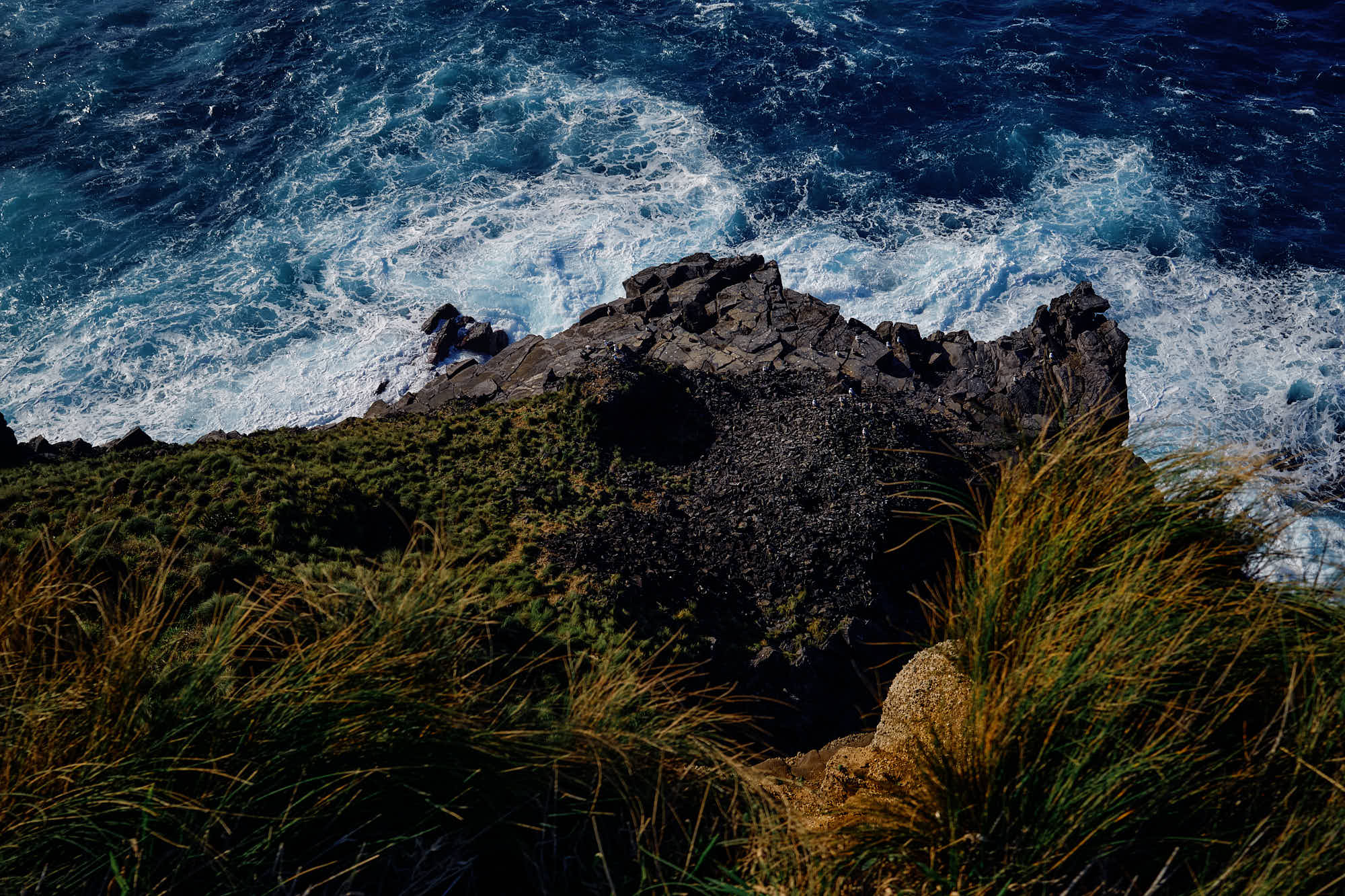 Atlantic surf breaking on the black lava coast of São Miguel