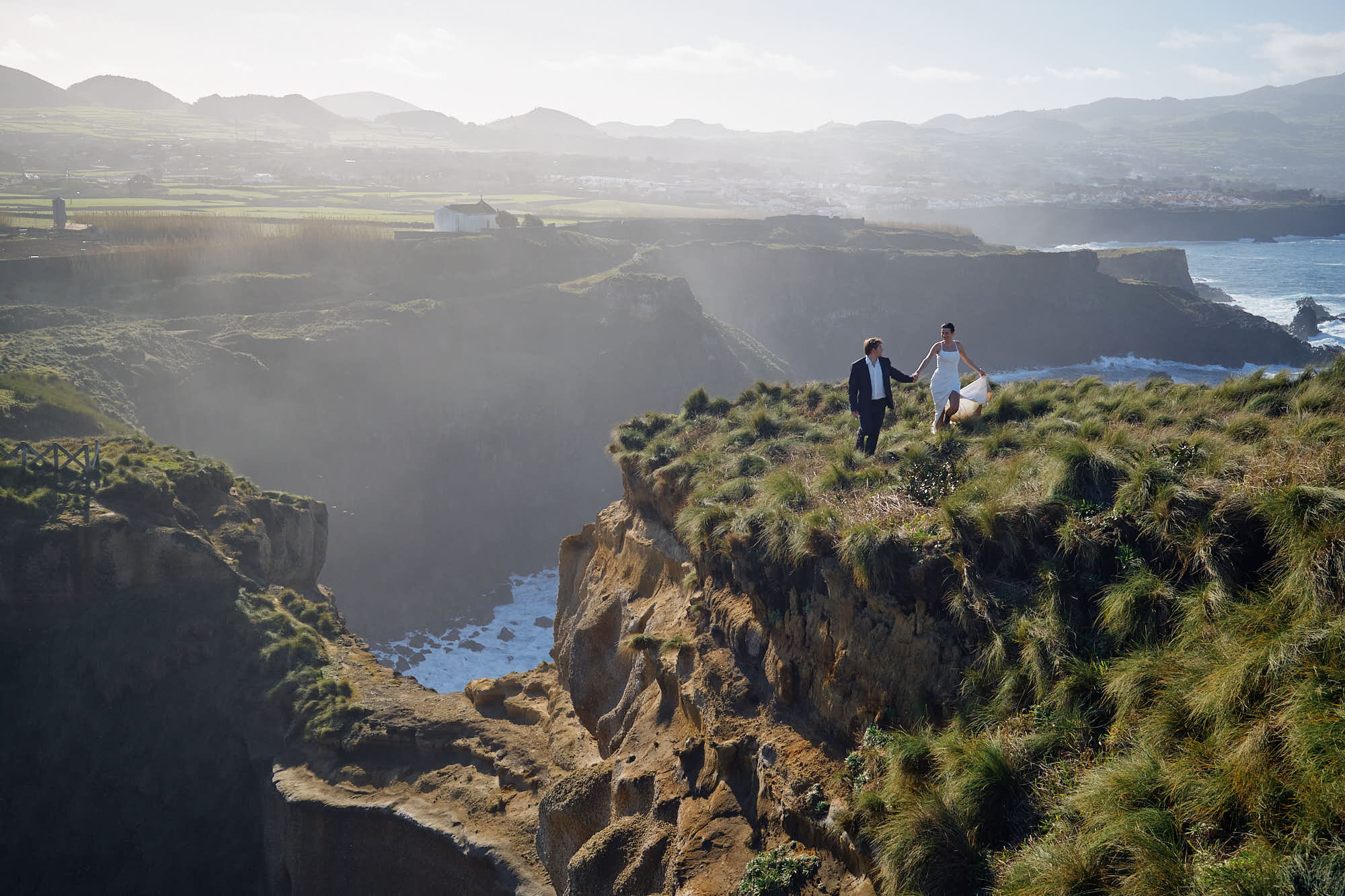 A couple on the clifftops above the Atlantic on São Miguel