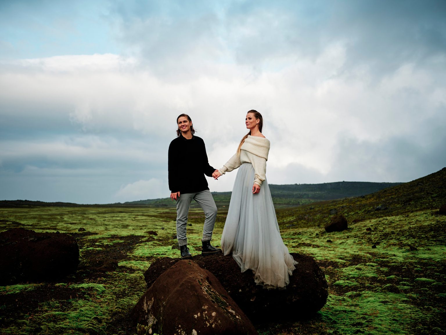 Holding hands on the mossy lava, Snæfellsnes elopement