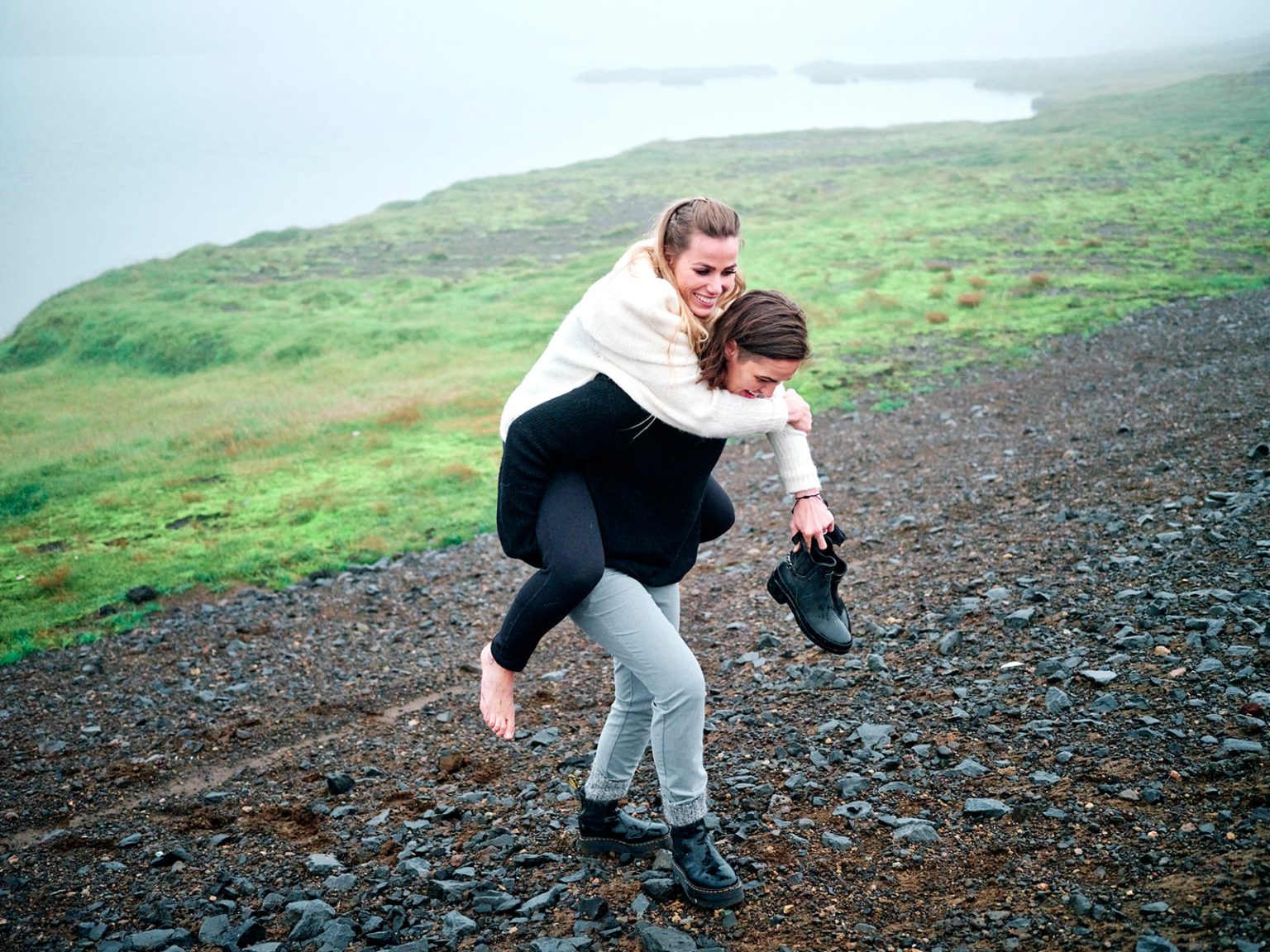 A piggyback on the beach, a candid moment on Snæfellsnes
