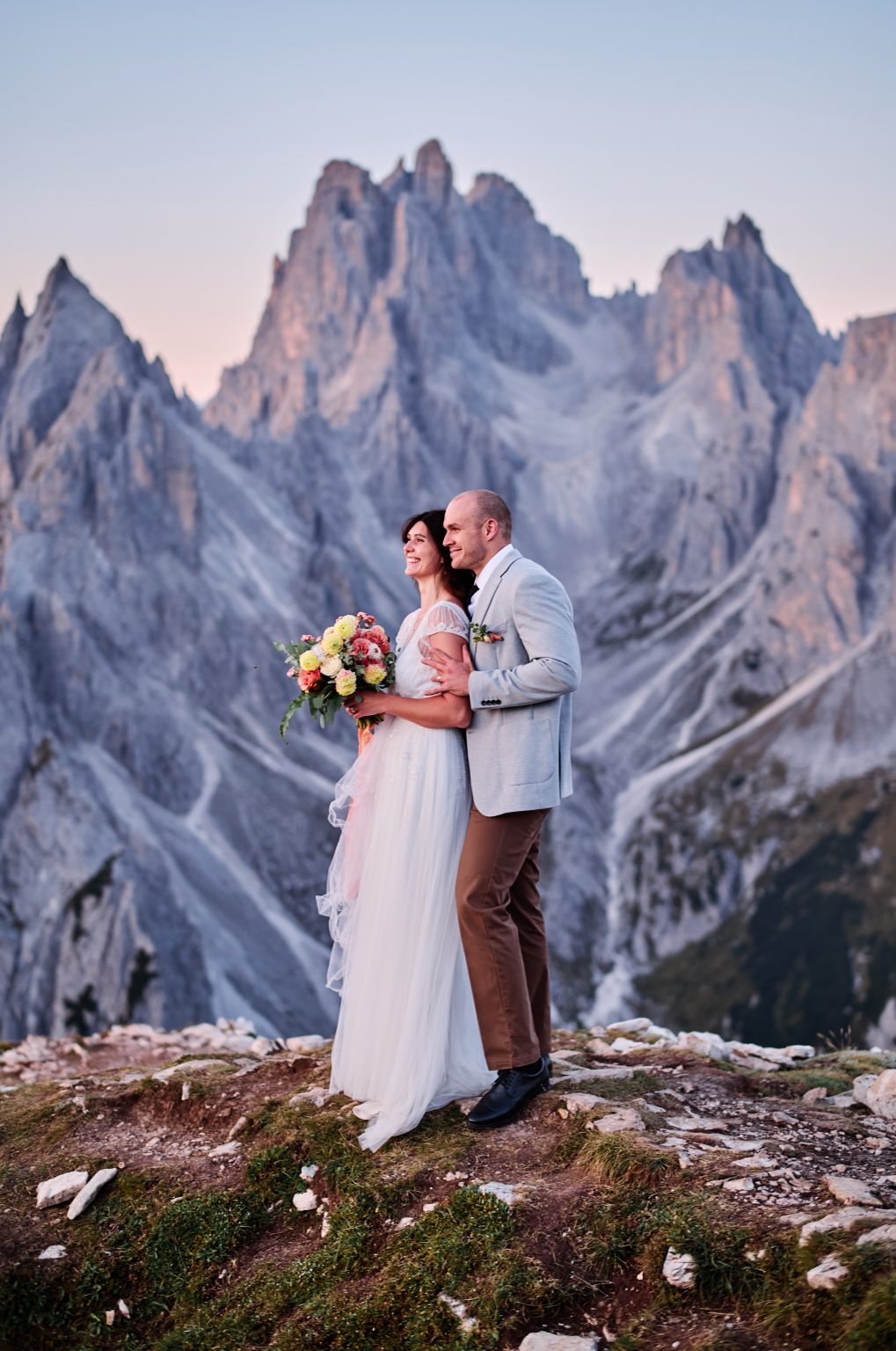 Lottie and Jack below the Dolomite spires, Tre Cime elopement