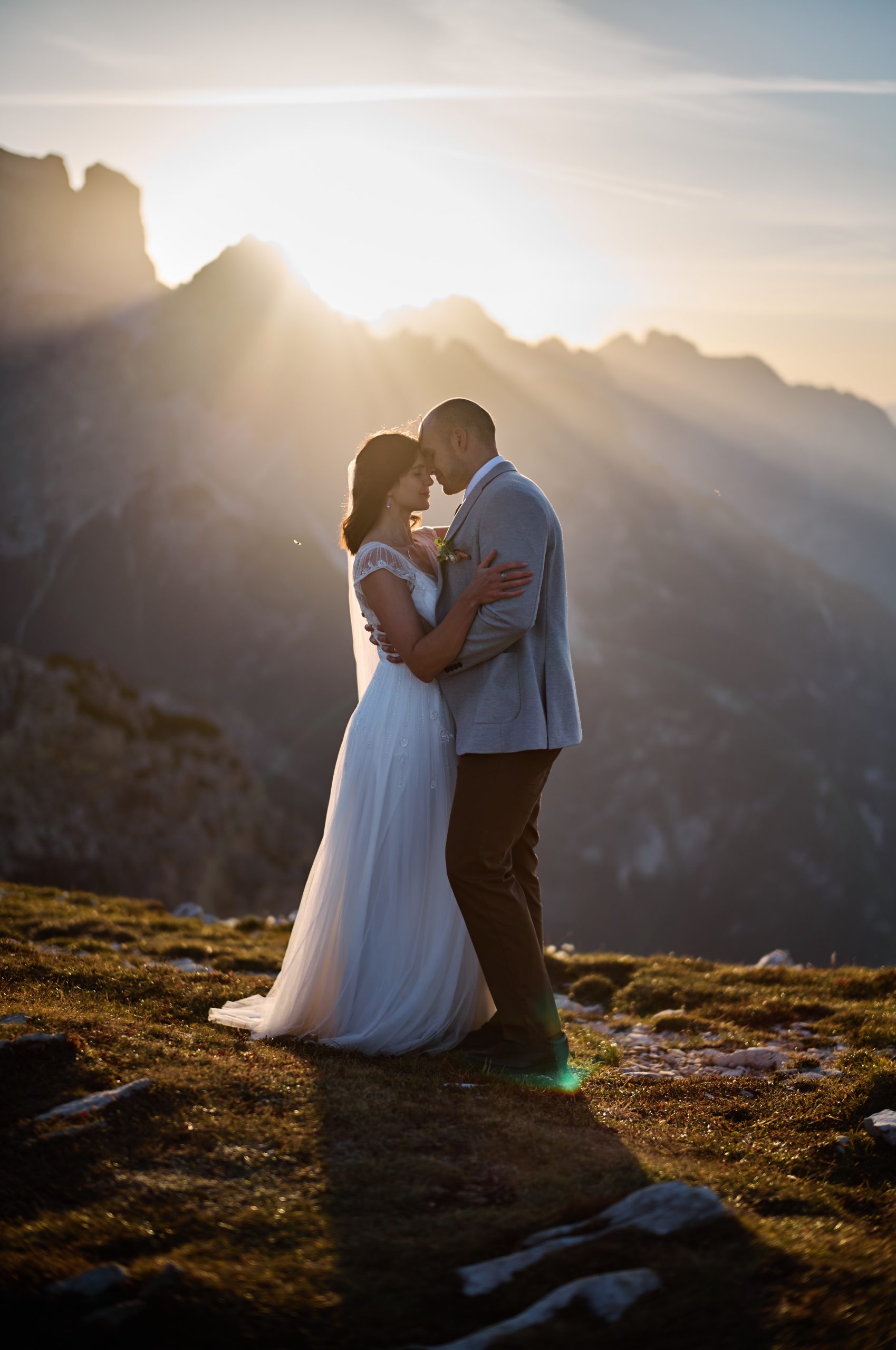 Couple embracing at sunrise, Tre Cime di Lavaredo elopement photographer