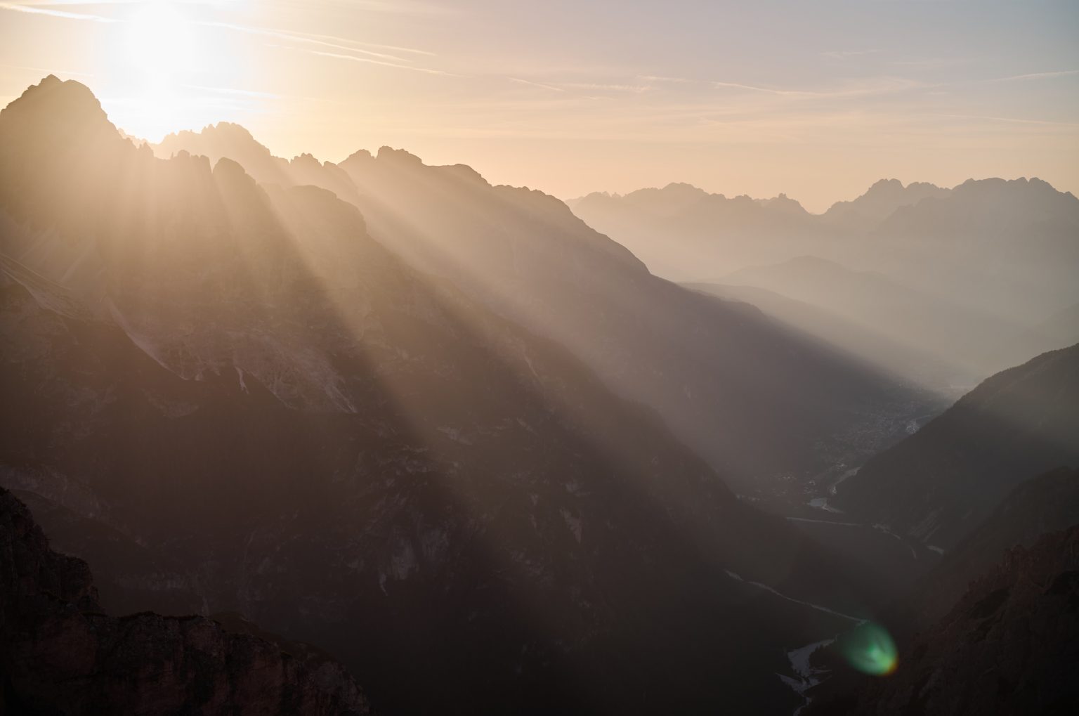 Sunbeams over the Dolomites at sunrise, Tre Cime elopement