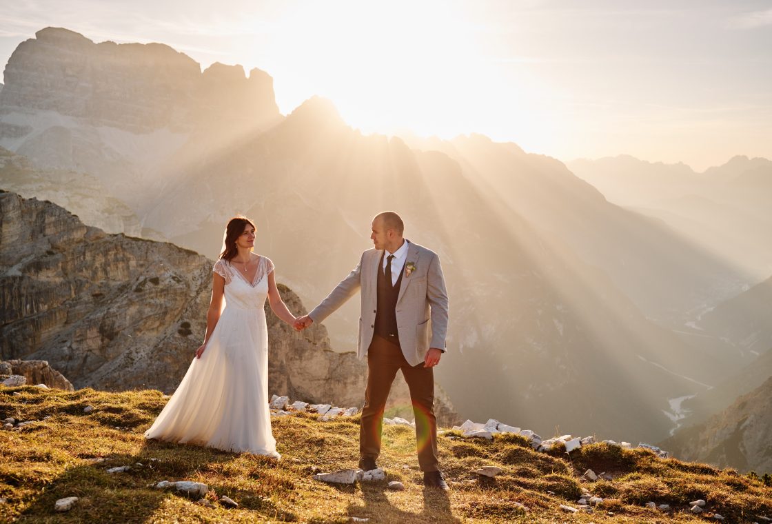 Lottie and Jack in the sunrise light at Tre Cime di Lavaredo, elopement photographer