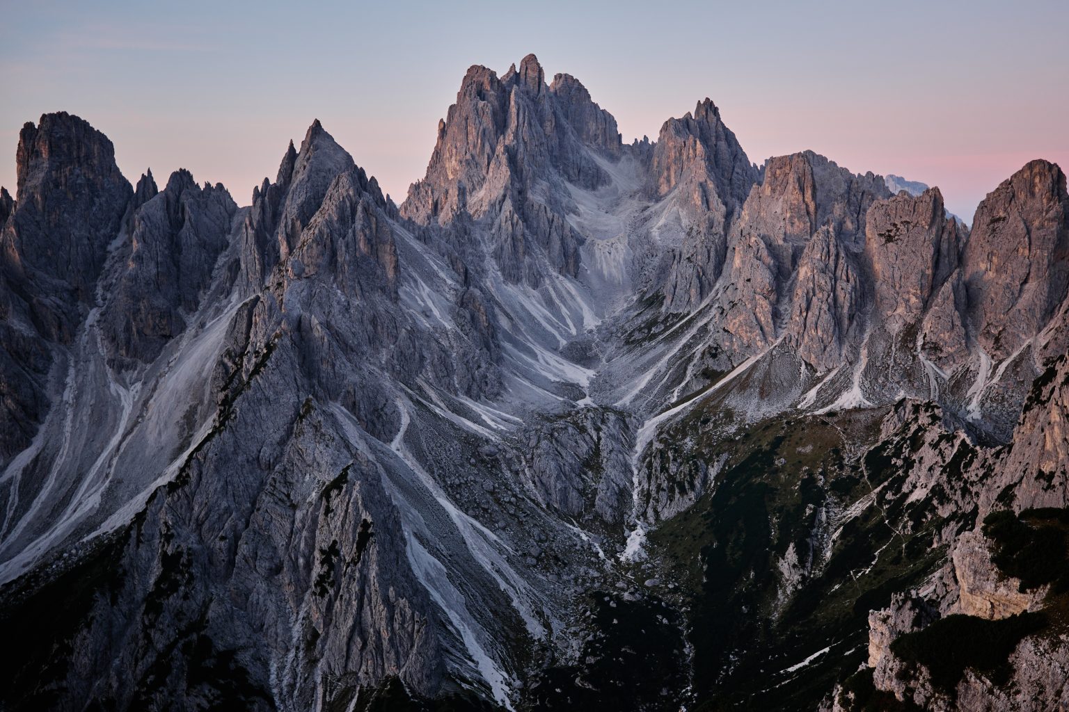 Couple below the Cadini spires, Tre Cime di Lavaredo elopement photographer