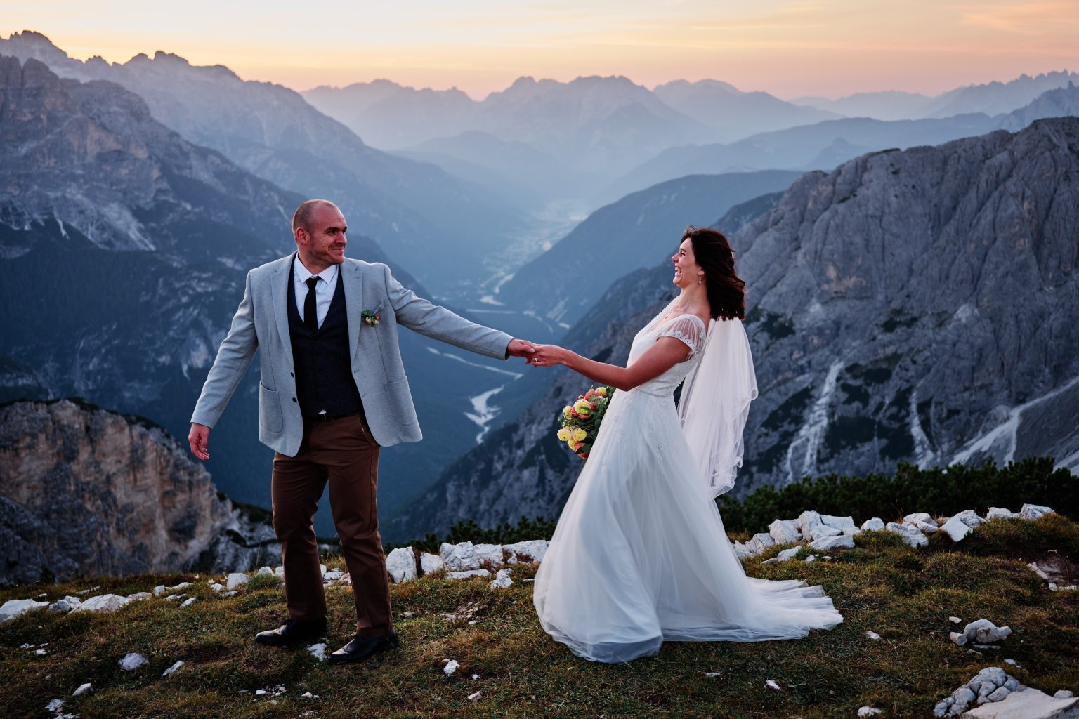 Couple on the ridge above the Dolomites, Tre Cime elopement