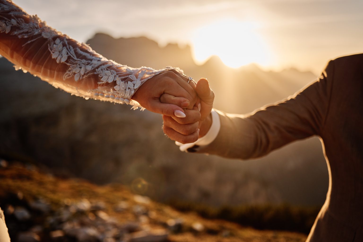 Golden light and joined hands, Tre Cime di Lavaredo wedding