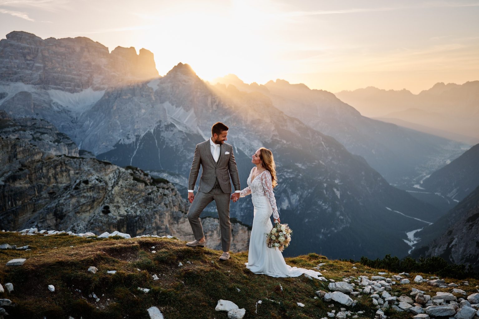 Charlotte and Collin walking into the sunrise, Tre Cime di Lavaredo