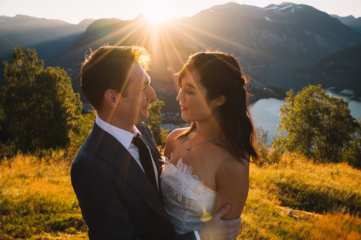 Ida and James in the sunburst at dawn, Norway wedding