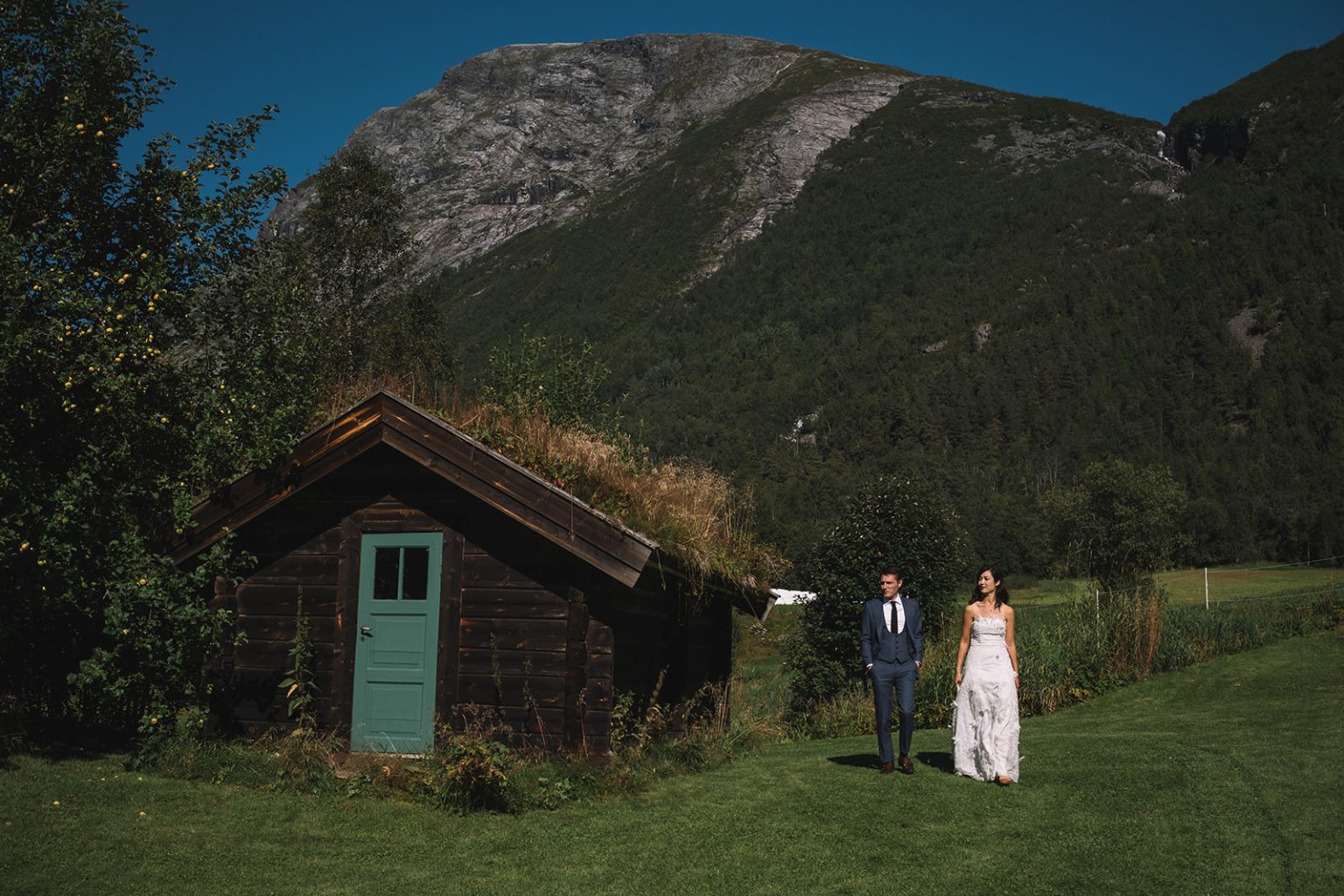 Ida and James by an old turf cabin at Juvet, Norway wedding