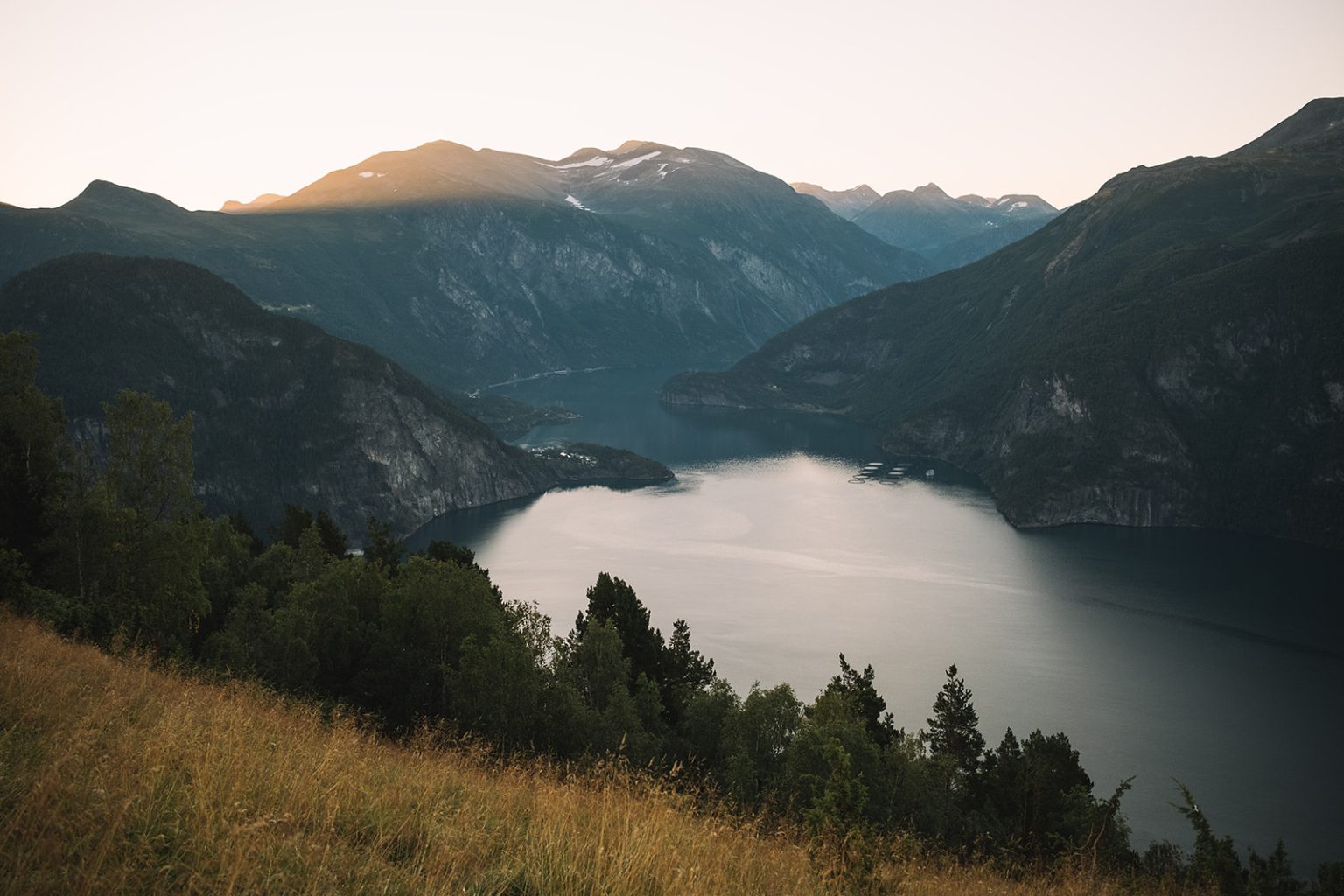 Dawn over the fjord and peaks above Juvet, Norway