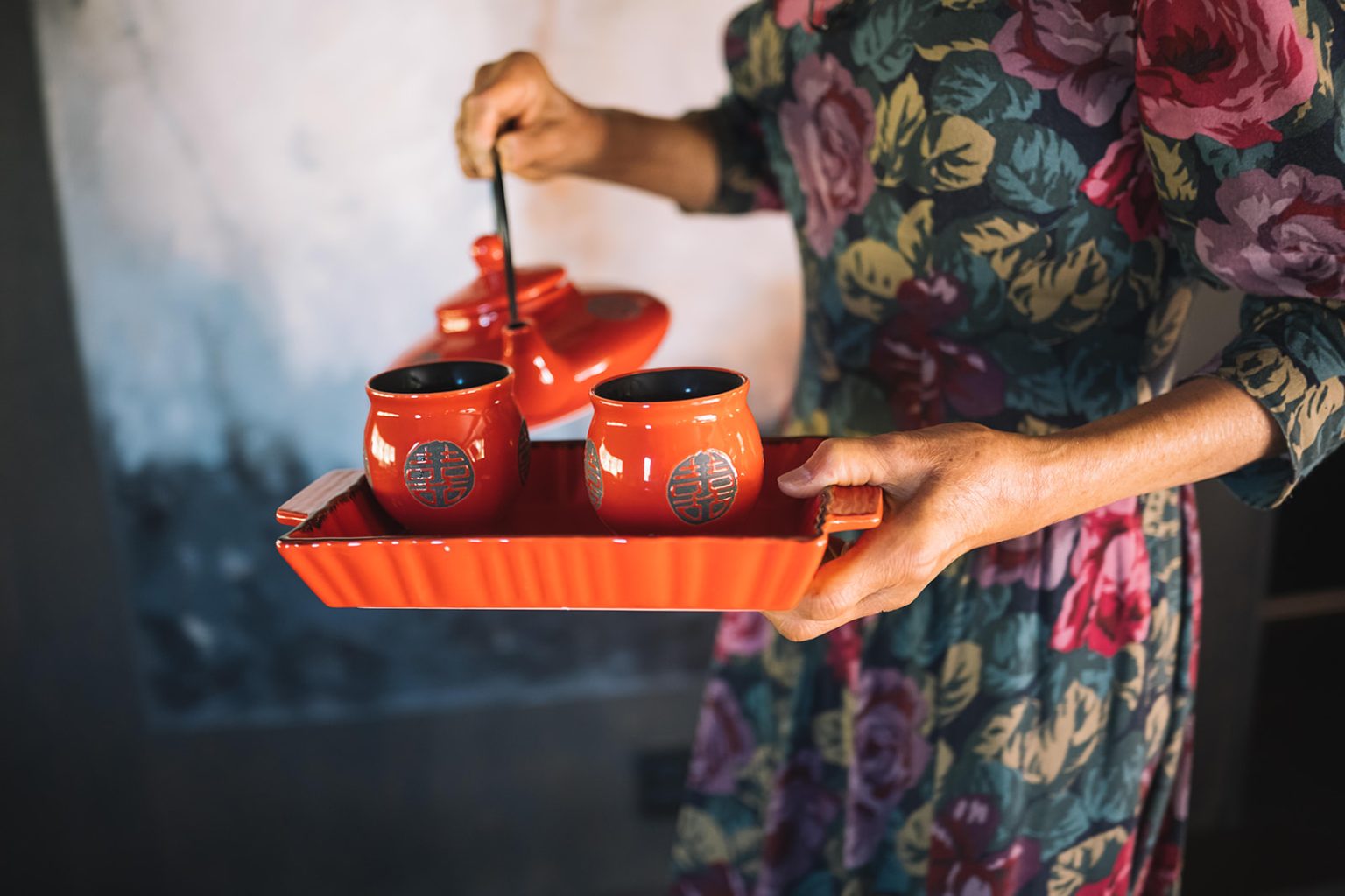 Pouring tea at the Chinese tea ceremony, a Juvet Landscape Hotel wedding