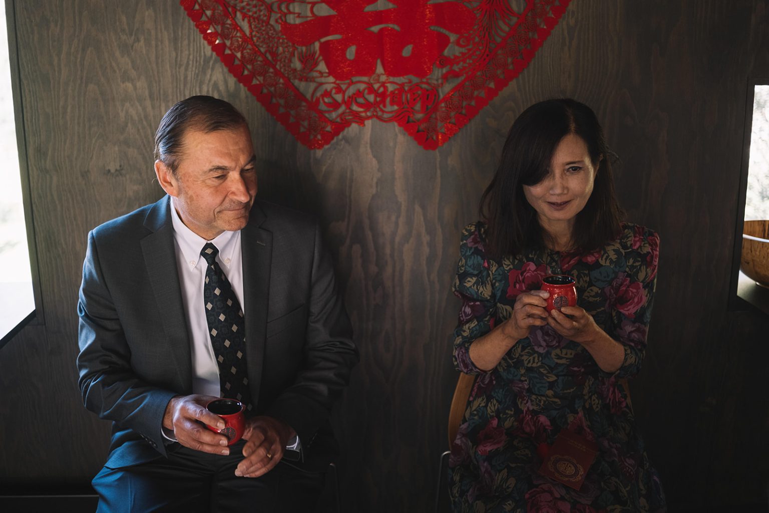 Serving tea to a parent at the tea ceremony, a Juvet wedding photographer