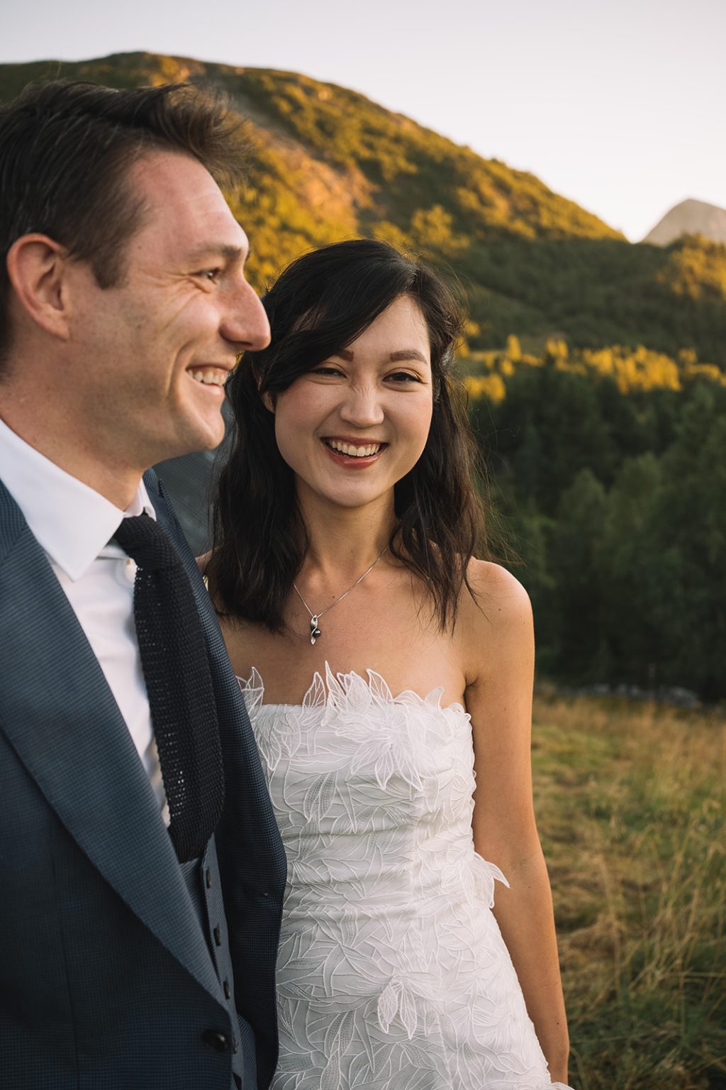 Ida and James laughing together at dawn, Norway wedding