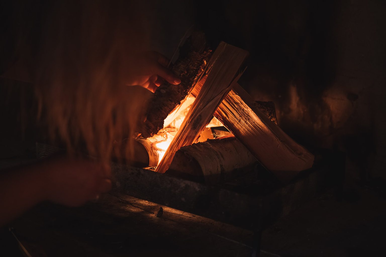 By the fire as night falls at Juvet Landscape Hotel, Norway