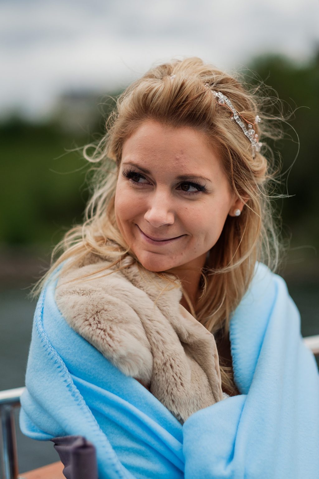 Portrait of the bride wrapped up on the boat