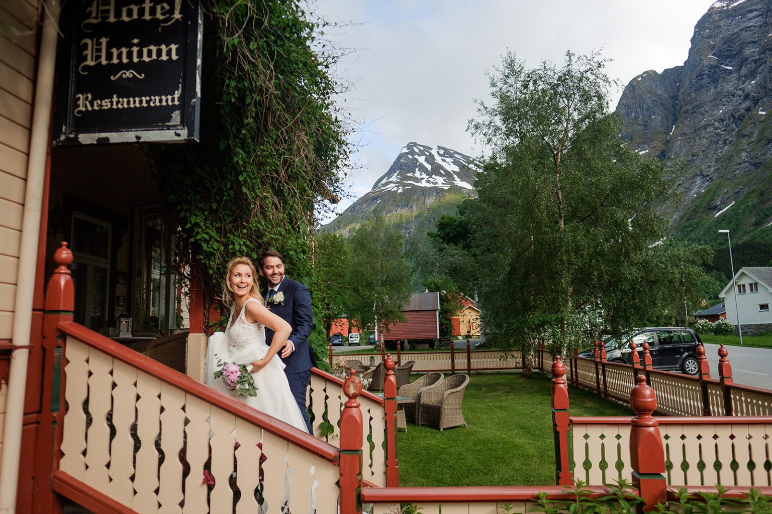 Bride and groom on the grand staircase at Hotel Union Øye