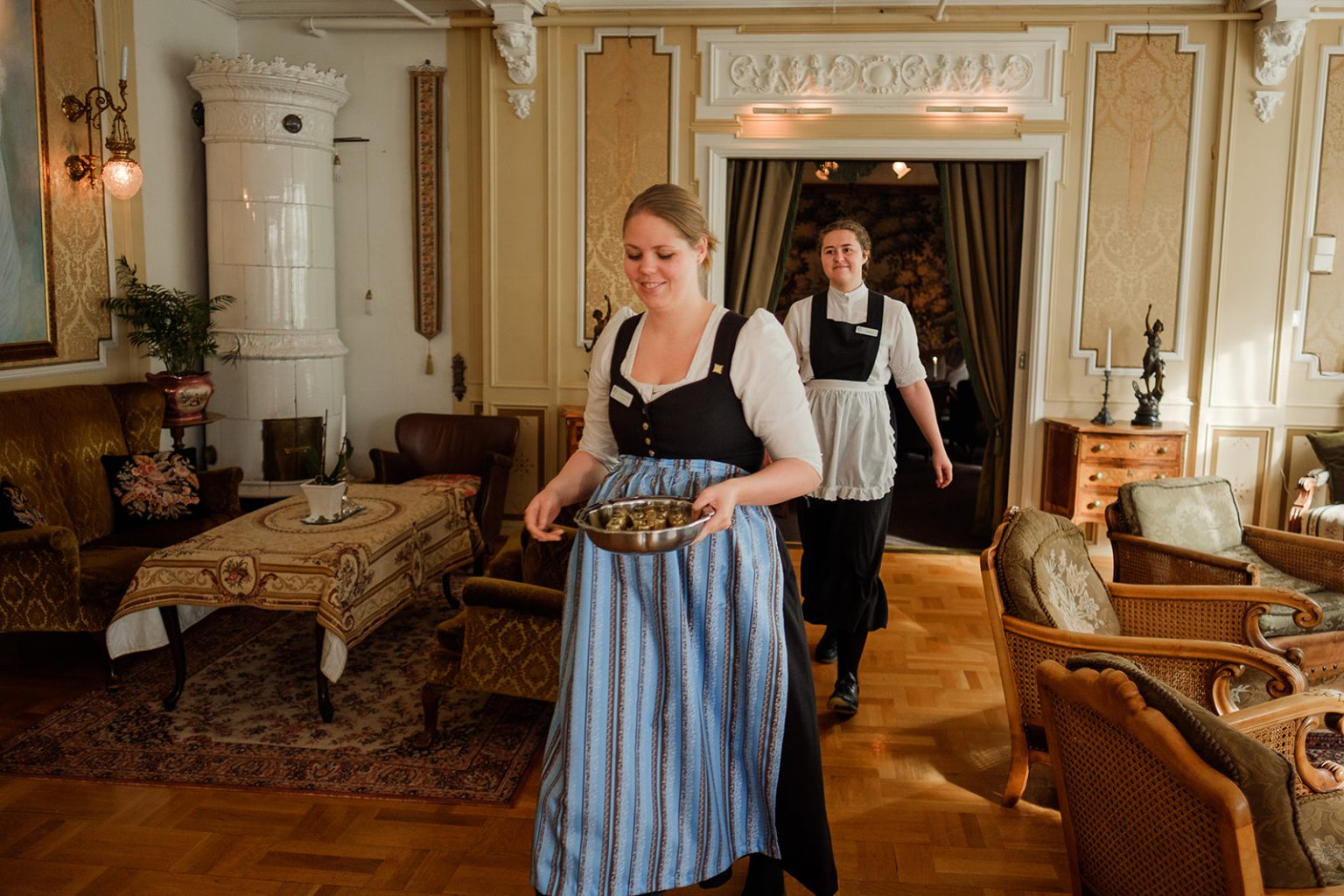 A member of staff in traditional dress at Hotel Union Øye
