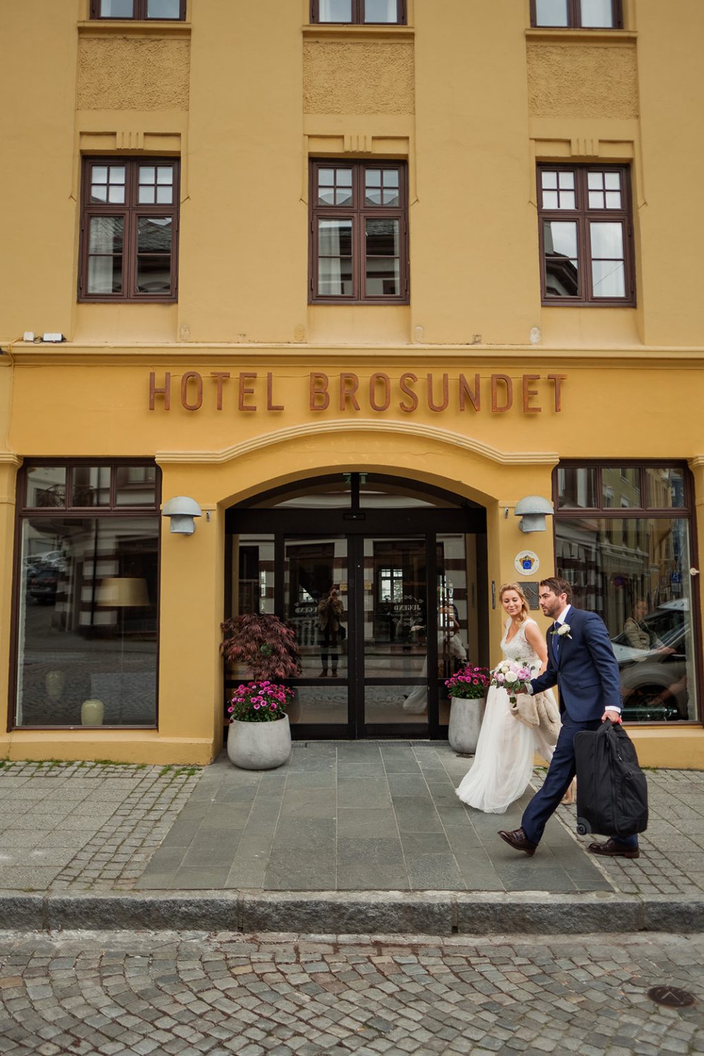 Bride and groom outside Hotel Brosundet, Ålesund