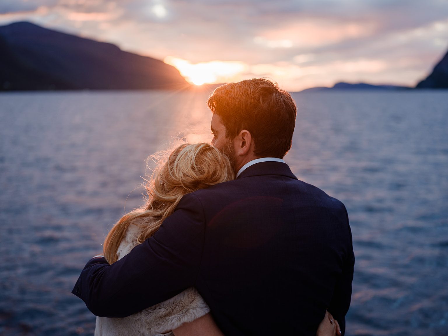 Bride and groom at sunset on the boat, Hjørundfjord